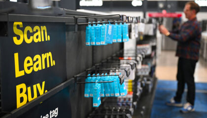 A row of packages in a Best Buy store